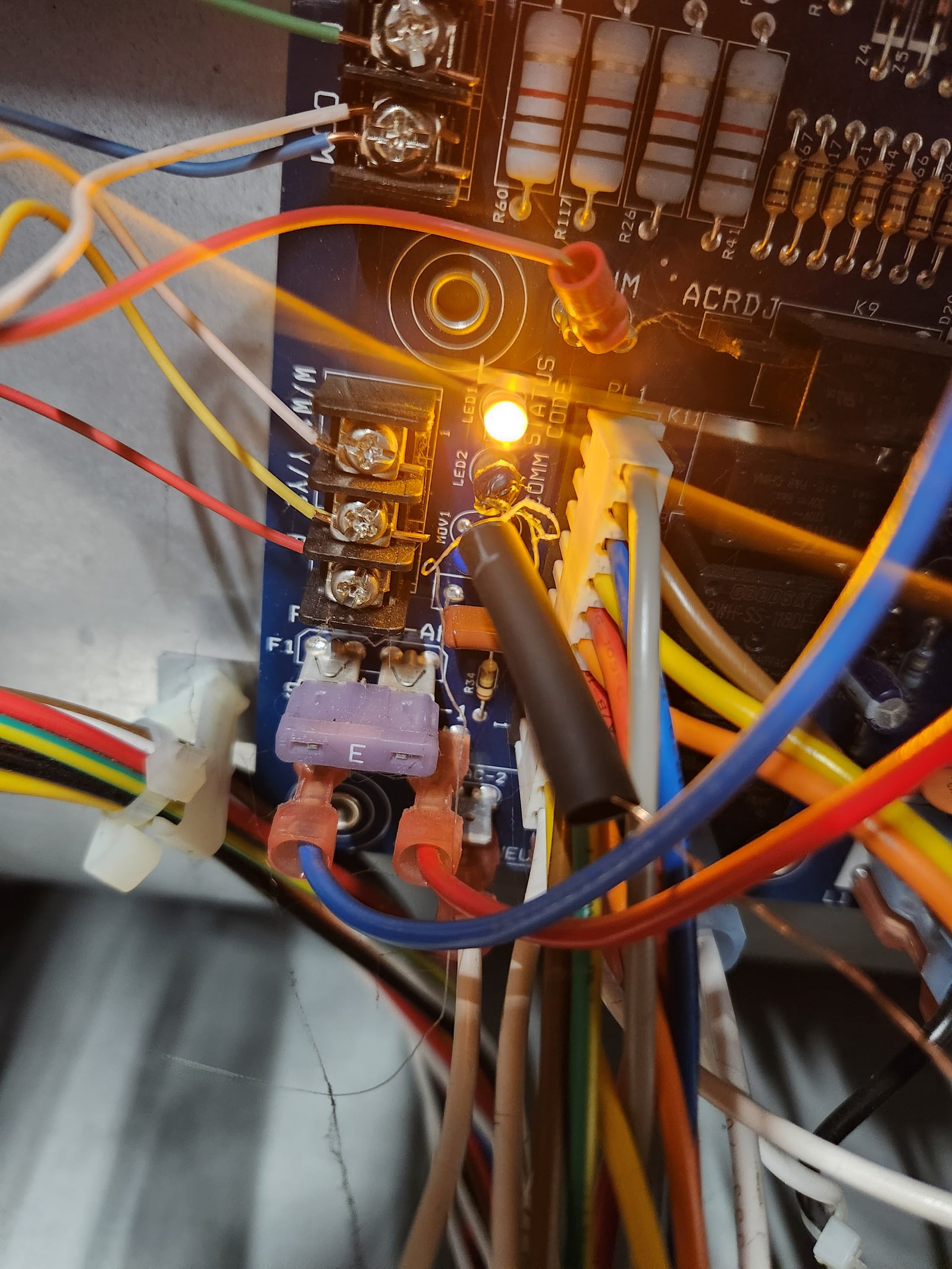 The CdS photoresistor, heat-shrunk in place over the control board&rsquo;s status LEDs (LED1 lit steady-on, the normal state)